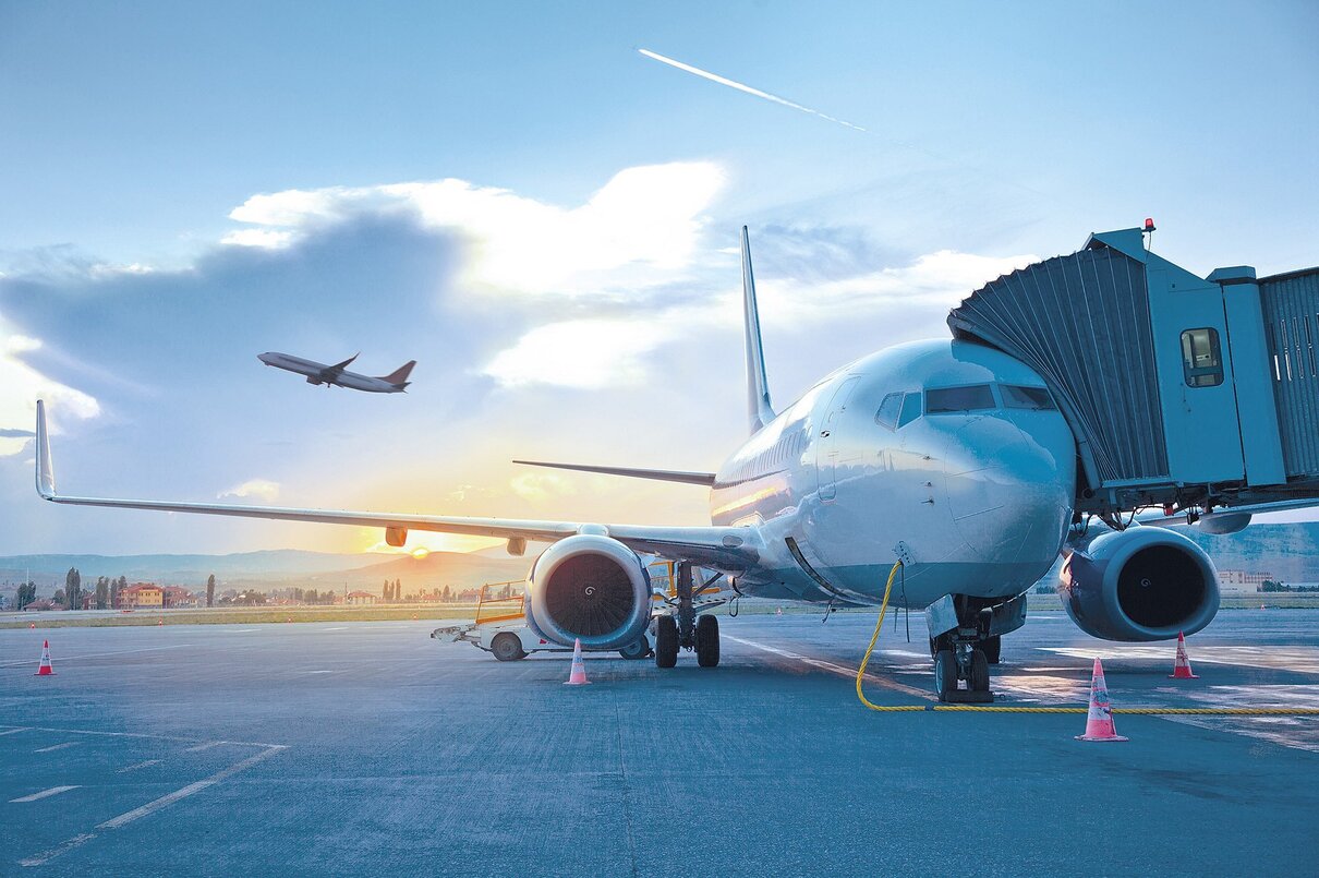 Passenger airplane taking of at sunrise