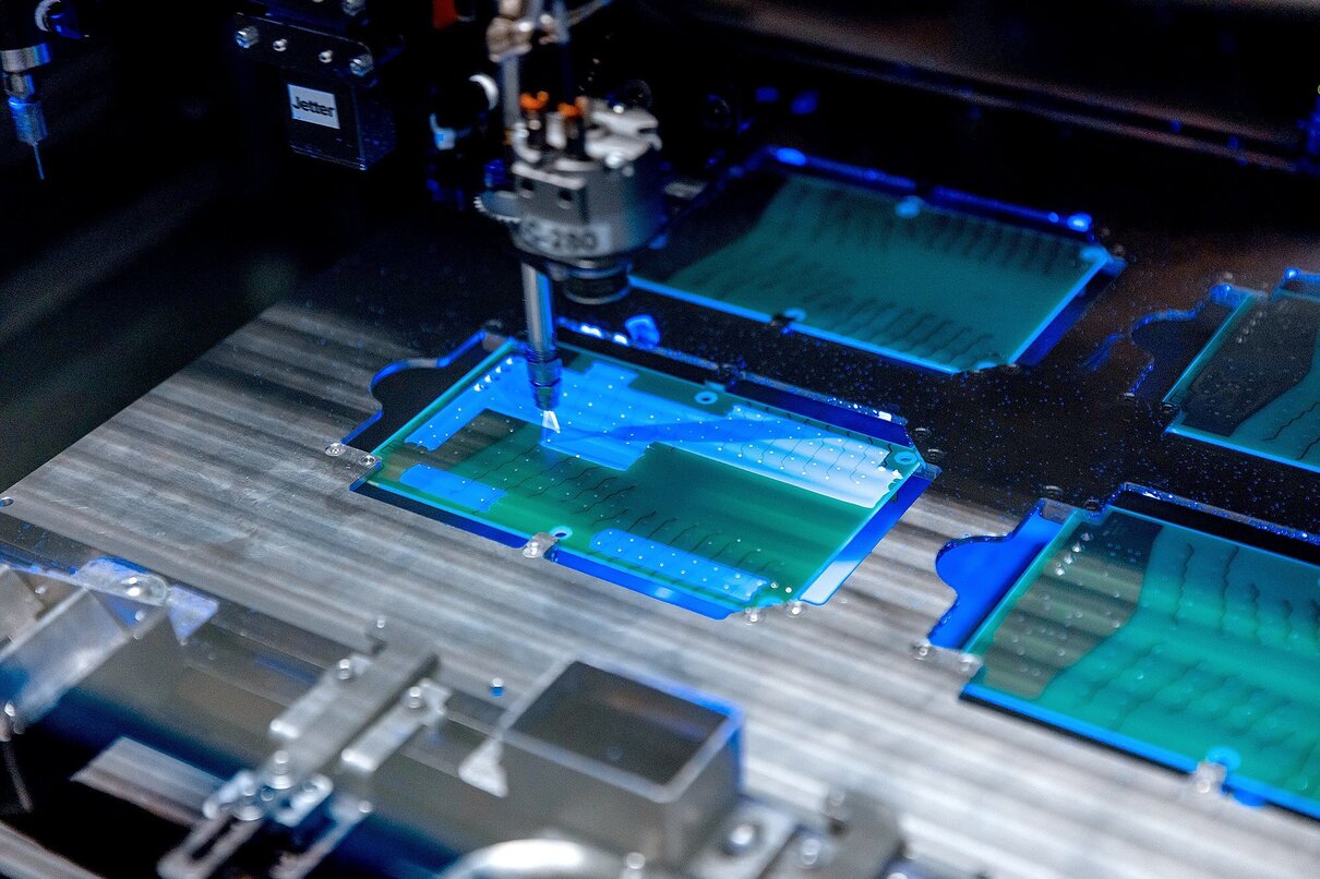 Flexible robotic conformal coating and dispensing system for selective coating potting, bead, and meter-mix dispensing applications